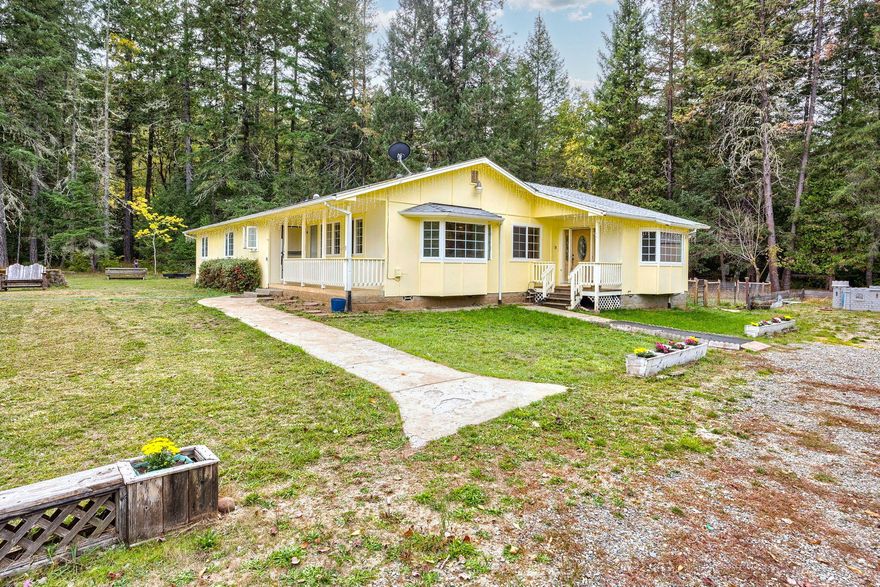 You have found your Oregon paradise! This spacious 2,386 sq. ft 4 bed 2 bath ranch style home sits on 40.22 acres of mostly flat usable farmland. Nested at the conjunction of the Illinois Valley and the foothills of the Siskiyou mountains, this EF zoned property has 5.2 acres of irrigation rights from year round Elder Creek and Little Elder Creek which flow through the property. Surrounded by a cathedral of mixed forest, a thick grove of second growth marketable fir and cedar add great value to this property. A 1200 sqft insulated metal shop with mini split climate control boasts endless potential. Complimented by a fenced garden site with raised beds, The Ranch at Twin Creeks is the quintessential Southern Oregon paradise. Owner may carry for a qualified buyer with $370,000 down.