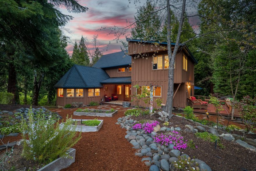 A serene apple orchard & farm in the Applegate Valley. Natural beauty & outdoor lifestyle-set in a private & picturesque valley. Rich w/ features-water rights for irrigation, an organic apple orchard, 600'+ of Thompson Creek frontage, + a 2nd seasonal creek. Surrounded by lush landscaping & mature trees, the home welcomes you w/ the warmth of wood floors, elegance of the fully remodeled chef's kitchen & natural light w/ the many skylights & windows overlooking this peaceful paradise. The west studio boasts high ceilings, sunroom, full bath & loft. The east studio has an open floor plan w/ a loft & a full bath. Also has a small detached office w/ a full bath. The finished shop benefits from 2 large bay doors & an office w/ heated floors. The cidery includes a large walk-in cooler + ample storage space & floor drains. W/ its inviting home, sprawling landscaping, agricultural capabilities & variety of supporting structures, this is an amazing opportunity. Business not included