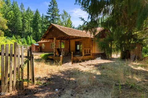 Photo of 13245 Caves Highway, Cave Junction, OR 97523 (MLS # 220225867)