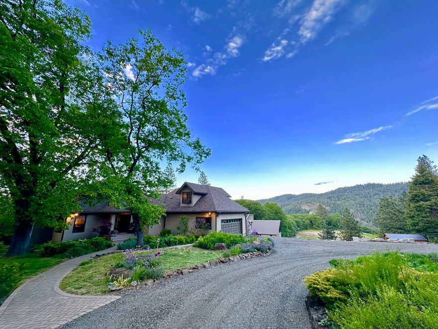 This meticulously maintained private 20.9 acre estate features an elegant main house with majestic views from every room, original oak and reclaimed oak barnwood floors, mature landscaping, a large sprawling lawn area and an outdoor guest bathroom. The attached 2 car garage is insulated and finished with windows and shelving. The property includes an 1,800 sq ft. barndominium, a deer fenced garden, firewood storage custom built from logs off the land, six outbuildings, a large pasture and horse shelter, and a magnificent arena and round pen. In your own private park enjoy the lovely walking/riding paths that wind through meadows, a conifer forest over a seasonal pond and into a large oak savannah where you can lose yourself in the beauty of nature. In the main house the master bedroom has a lovely screened-in porch, the upstairs bedroom has inspiring views of the land and sky with a separate staircase entrance. Come experience the joy and peace this property offers.