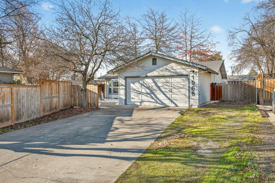 Beautifully situated on a quiet street, this turn-key home offers privacy and plenty of space. Inside you'll find 3 comfortable bedrooms, 2 bathrooms, and fresh laminate flooring in the entry, dining area, kitchen, and both baths. The attached two-car garage includes an automatic opener and there is additional room for RV parking. The large, well-kept yard is perfect for entertaining, featuring a covered patio and lush lawn. Conveniently located close to schools, medical facilities, shopping, and restaurants.