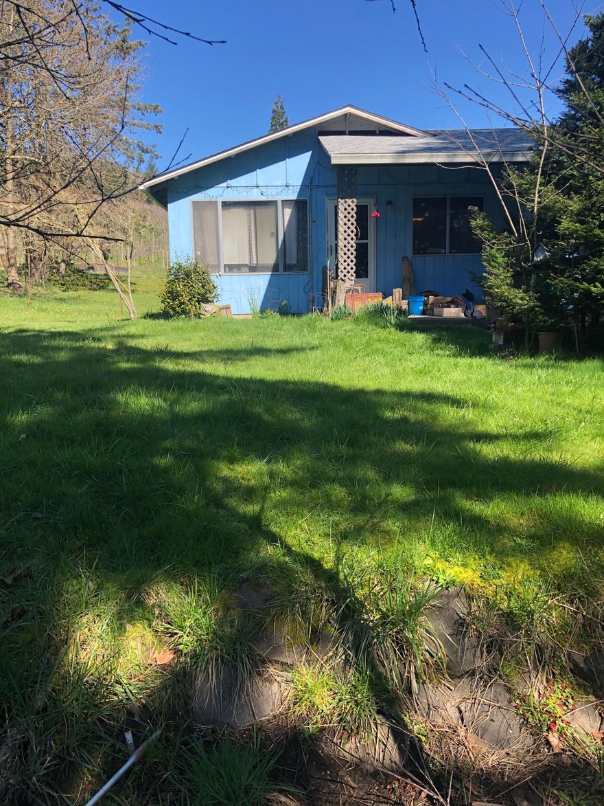 Come see this beautiful .68 acre property and home backing up to a well established vineyard. The home has a huge capacity for being a great property for a first time purchaser or investor. This 3 bedroom, 1 bath house has amazing potential for being a great property.  Come feel this homes energy, roll up your sleeves and turn this property into a show place that you can be proud to call home.