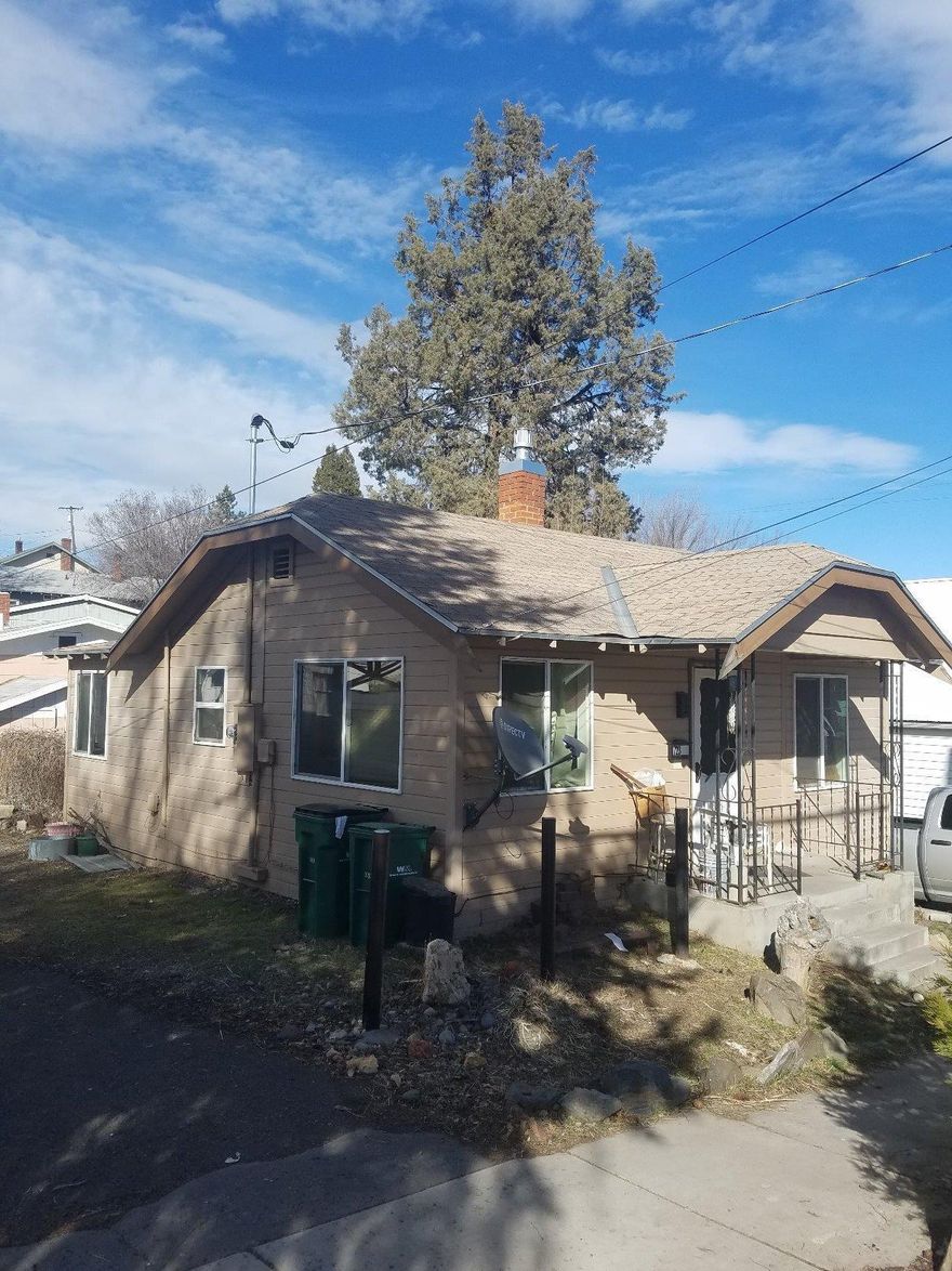Larger than it looks! This quaint little cottage has two bedrooms, attached garage/carport, partial basement for additional storage and fenced in back yard.