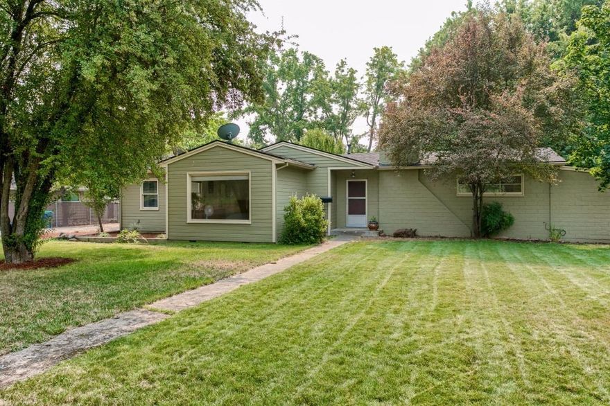 Absolutely charming 1949 built East Medford home with extensive hardwood and ceramic floors, large windows and a huge finished office/family room area not included in the 1365 square feet. 2 spacious bedrooms/1.5 baths, the full bath has been completely redone with ceramic tile floors and shower, new vanity, counter top and fixtures. French doors, wood burning fireplace, private patios and seating areas are just a few of the highlights. Mature landscape features a large deck, 2 water features and well for landscape irrigation all located on a 1/2 acre lot. This lovely home is located directly across the Rogue Valley Country Club a real find! mature trees and landscaping. Lot size may allow for an additional dwelling. Buyers to complete their own due diligence.