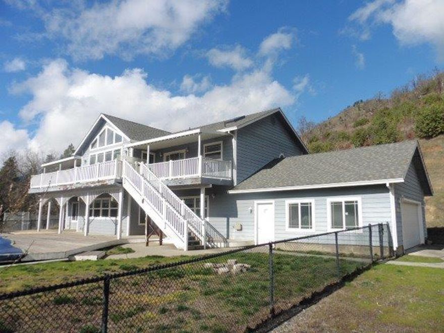 Large sq ft home perched on a hill offers great views. Large deck built around the pool as well as an upper deck to take it all in. Main (upper) level offers a fantastic living room with a wall of windows to bring in all the light an also offers the large master suite and well appointed kitchen with a great walk-in pantry. Lower level offers 2 more living rooms, 3 bedrooms and more bathrooms. Property offers easy access to freeway and an oversized 2 car garage.