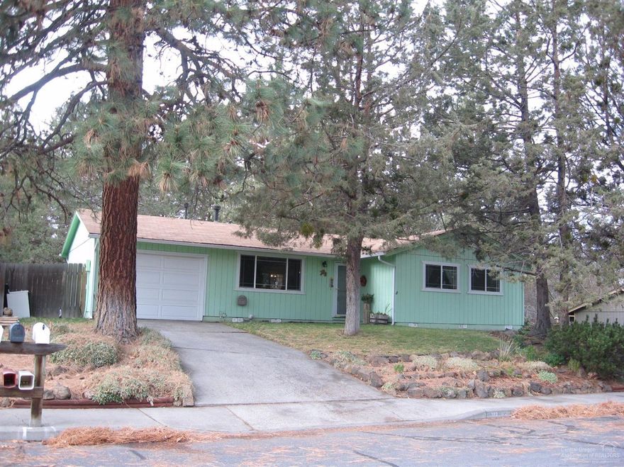 The perfect starter home or ideal for someone who is downsizing. You will appreciate the convenient location close to shopping, Vince Genna Stadium and nearby parks. Recent upgrades include new windows, garage door and opener, gas heating stove and laminate flooring throughout the main living area. Spacious yard with mature trees and a fenced backyard with a pergola covered deck. This is a well maintained home in a sought after neighborhood.