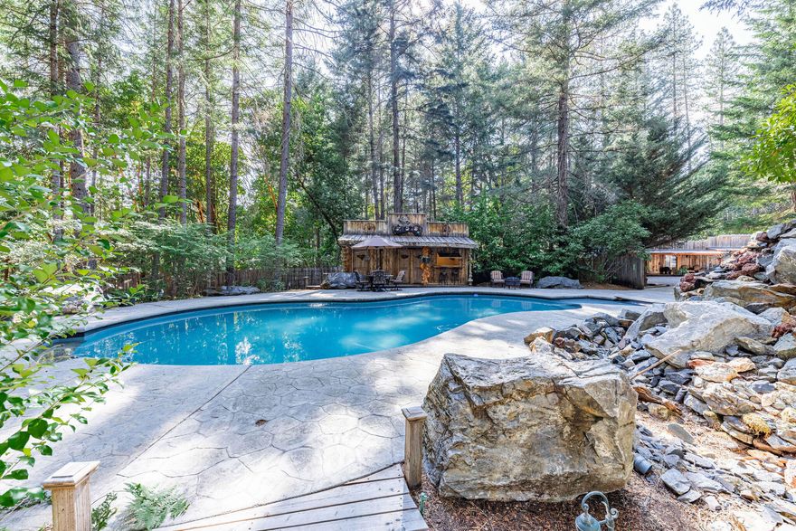 This Unique, One of a Kind Property on 3.98 acres has it all!! Main House, ADU, 3700 sq ft Shop with Bar, In-ground pool with Rustic Pool House and full bath, Hot tub, Koi pond with waterfall and an old mining town feel, Pole Barn and an Oversized 2 Car Garage. The Main house is 1880 sq ft with 3 Bedrooms, an Office and 2 Bathrooms. Split floor plan with updates throughout include Hickory hardwood flooring in the main living areas, gas fireplace, and remodeled kitchen. The ADU is 800 sq ft with 2 bedrooms and half bathroom, full kitchen. The Shop includes RV sized automatic doors, a Vehicle Lift, Bar Area, Full Bath, and washer/dryer hookups. Follow the paths around the property while being transported back in time and taking in the beautiful landscaping and enjoying the abundance of outdoor entertainment areas and wildlife. Fully fenced property with 2 automatic gates,2 wells, main house generator, greenhouse, and plenty of room for all your toys, friends and family.