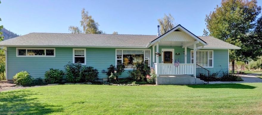 Beautiful farm land! This 3 bedroom 2 and 1/2 bath home has been completely remodeled. Updated kitchen. Hardwood floors. Hybrid HVAC system. Irrigated pasture land. 2 30x100 open barns with 3 concrete in-bays, water, and electrical. 35x50 Two Story (AMAZING) Shop with two large roll-up doors, water, and individual electrical meter. Water catchment system that has 2 2500 gallon tanks with gravity flow/pump and underground piping to water the garden. 2 story milking barn with individual electrical meter and roll up door. 2 irrigation pumps for field and garden with water rights. Tree orchard with English Walnut, Pear, various Apple, and Peach. Zoned EFU. This is an incredible property and an opportunity not to be missed!