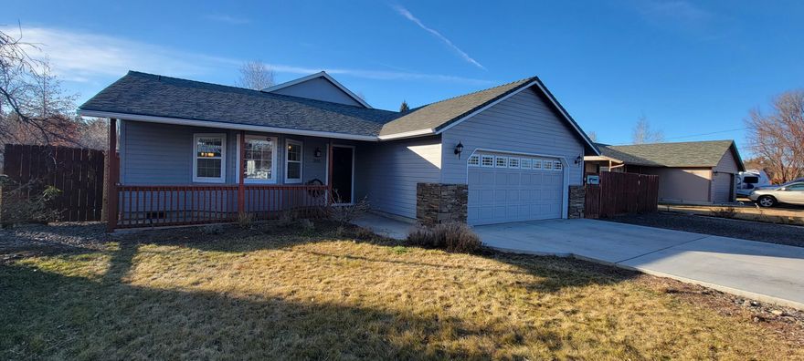 RARE find in the heart of Redmond. This spacious home is beautifully renovated and perfect for a multi family set up! Has it's own attached 2 bedroom/1 bath ADU thats an active Airbnb rental! Features beautiful new kitchen with large island & farmhouse sink, new flooring, 5 bedrooms, bonus area, family room with cozy wood stove and great room. Almost a half acre lot with newer finished 1,040 sq ft shop w/separate entrance! Peaceful backyard setting with covered patio, delightful garden area, sprinkler system, fully fenced and landscaped. RV parking. This home is a unicorn and a must see!