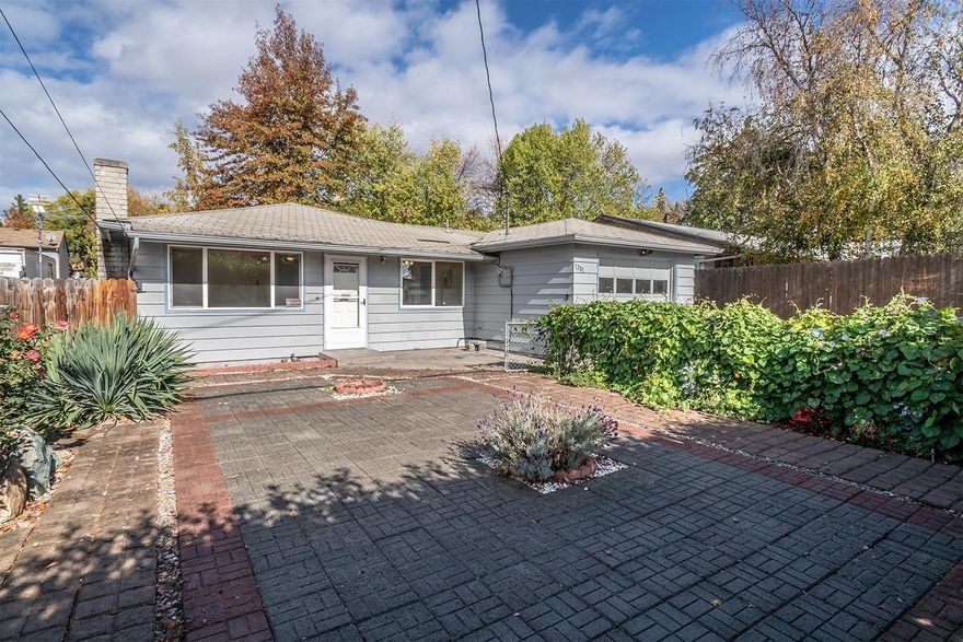 Charming 3 bedroom, 1.5 bath East Medford home conveniently located in the heart of town and just blocks to shopping, medical, entertainment and schools. It's a wonderful location to call home, but also an ideal location if you've been searching for the perfect investment property. The home recently received a number of upgrades including the kitchen, main bath and vinyl windows. It offers extensive hardwoods (no carpet), wood burning fireplace and the master suite has a private 1/2 bath. Outside you'll enjoy a covered patio, spacious yard area and extensive pavers making this space usable, but also extremely low maintenance. Mature trees, 2 large garden sheds, attached garage, room for an RV in the front and the fridge is included - this great package is turnkey, move in ready!