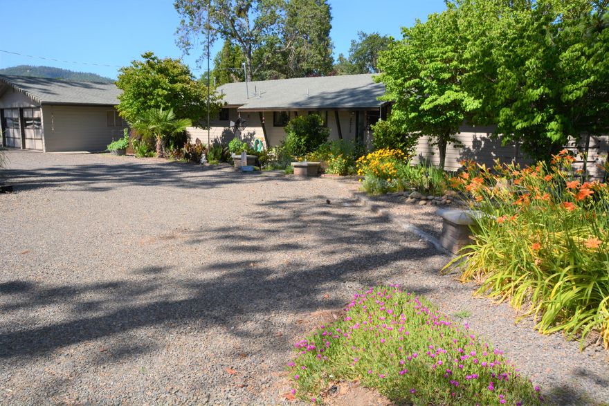 Perfectly located! Minute to Jacksonville and Medford this 3 bedroom, 3 bath home offers a country feel with quick access. The home is situated on 2.39 flat acres, perfect for a mini farm, with 2 acres of irrigation rights. The pasture is fenced and ready for your farm animals . The warm and cozy ranch style home has updated flooring, granite countertops. The owners suite includes a nice sized private bathroom. The floor plan is open with soaring vaulted ceilings. Outside find a covered patio and mature landscaping. The irrigation has 5 field outlets with hardline and firehose . New pellet stove and a solar make this home incredibly efficient. The irrigation has f8 field outlets.