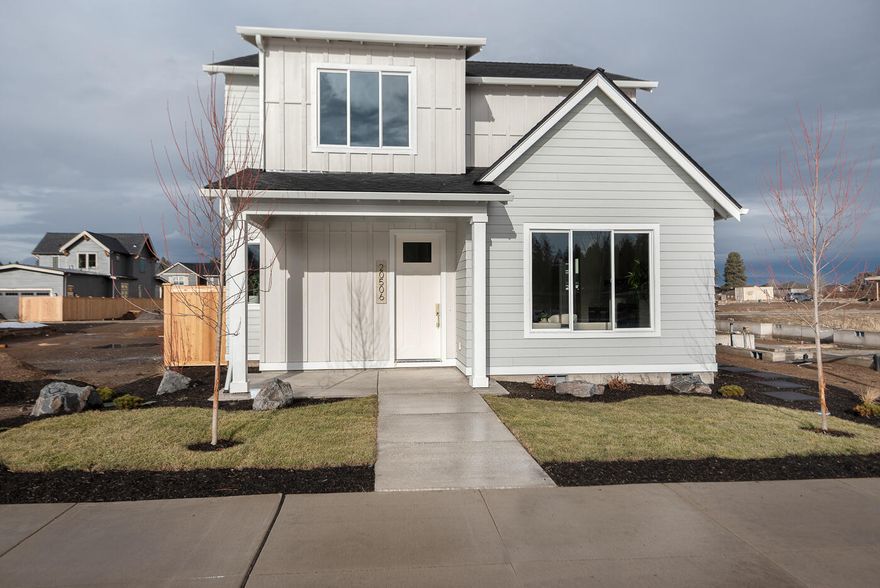 Modern farmhouse built by award winning Structure Development NW. Located in SE Bend near schools, parks and shopping. Open floor plan featuring great room with gas fireplace, tile surround and built-in. Spacious kitchen with stainless appliances, large kitchen island and pantry. Custom cabinetry and solid quartz countertops throughout. Modern lighting and plumbing fixtures. Private primary suite on main level. Two bedrooms, full bathroom and enclosed bonus room on upper level. Covered side patio adjacent to kitchen and access to yard off dining area. Double-car garage, lots of storage, fully landscape with sprinkler system and fencing.