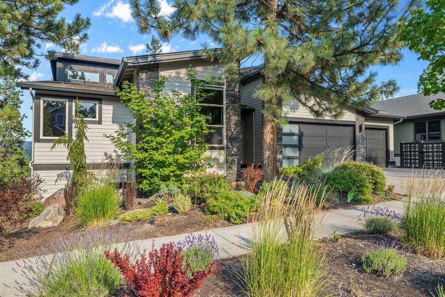 Stunning home w/3780 sq ft of luxurious living space that is perfect for entertaining inside and out. 5 BRs, 4.5 BAs, a great room, and 2nd family room, 2 laundry rooms, 2 kitchens, a 3-car garage & 2 lg covered decks. Situated on a .29-acre lot in a great west side location on a quiet cul-de-sac. This home offers both elegance & tranquility w/peaceful views of trees and Awbrey Butte. Main level boasts a huge great room w/vaulted ceiling & beautiful stone fireplace. Gourmet kitchen w/island is a Chef's dream kitchen w/ Wolf range, wine refrigerator, 2nd oven & walk-in pantry. Large dining area opens to lg covered deck w/outdoor grill & built-in space heater. Primary ensuite, 2 BRs, full bath, powder bath, laundry room & 3-car garage, completes the main level. Downstairs, you'll find another large family rm w/kitchen, 2 lg ensuites, 2nd laundry rm & abundant storage. Floor plan works well for Multigenerational living, too!