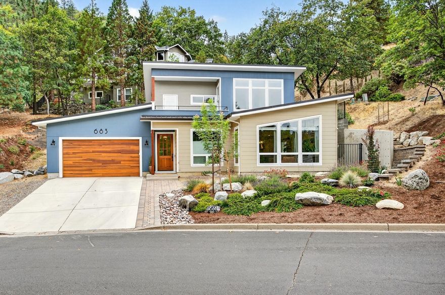 Recently built by Asher Homes, in gorgeous neighborhood near Lithia Park, this stunning modern home is full of beauty and well designed conveniences. Expansive views of mountains thru floor to ceiling windows w/remote control blinds. Gas fireplace.  Chef's kitchen w/ pantry, gas range, commercial range hood, island, granite countertops, Bosch dishwasher.  Primary bedroom on main floor opens out to Hotsprings spa on private patio. Lg shower, walk-in closet, radiant heat floors. Inviting office on main level as well as laundry room w/pedestal LG w/d, half bathrm & access to 2 car garage w/attic & extra storage room. ADA compliant. 2 bdrms upstairs w/bthrm and expansive landing w/TV & dry bar opens to deck overlooking the mtns & Lithia Park. High ceilings.  Great lighting, Quiet w/ lots of privacy. 6 mini splits.  Ample storage. Firewise designed w/screened gutters, metal roof & sprinkler system. Low maintenance landscaping. Fenced yard. Access to hiking and bike trails.