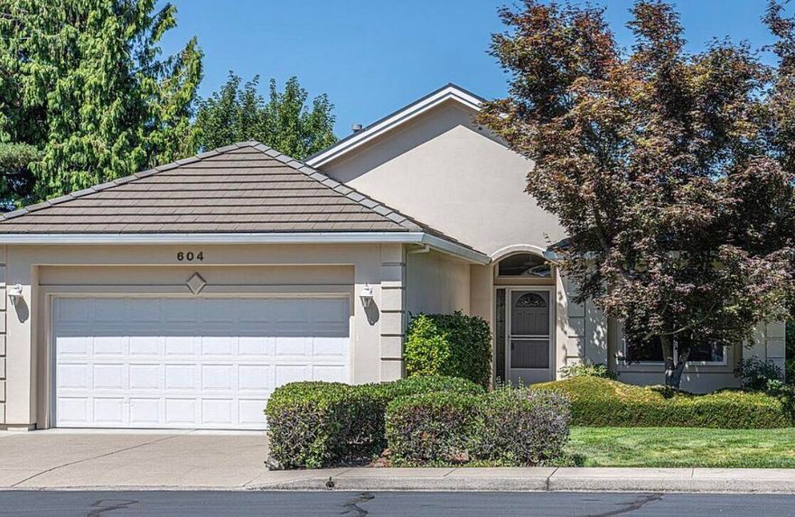 Welcome to this unique 2-bedroom, 2-bath home in the secluded Alder Creek gated community. A double-sided gas fireplace provides cozy ambience in the living room and dining area, and various small stained glass windows add decorative flair. A ''window'' in the wall between the living room and kitchen fosters connection between the two rooms and their occupants. The interior is light and airy with high-quality carpeting throughout. The spacious master bedroom has an ensuite bath with handy grab bars for safety. The other bedroom is suitable as an office or guest room. An unusual and welcome feature is dimmer switches on virtually all of the lighting. Additional grab bars on the entrance from the garage are handy for people of all ages. There is also a convenient built-in vacuum cleaning system. The HOA takes care of landscaping which ensures a carefree manicured environment. Schedule a tour today for the opportunity to make this wonderful home yours.