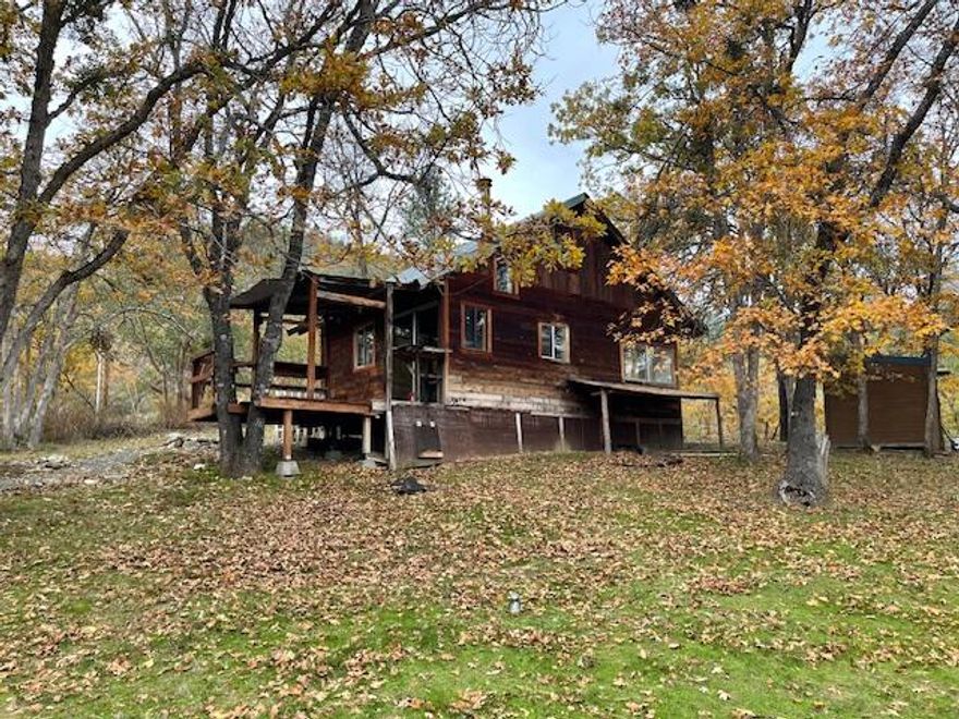 First Time on the market!Come and check out The Humbug Mystery House.The clever use of mirrorshelp to transport you back to a simpler timeand way of life when a sl;ower pace truly let you stop and smell the roses.Centrally located half way between Medford and Grants Pass, this private southern facing propertybacks up to BLM for hiking trails galore. Enjoy abbundant wildlife from your deck. This unique custom homeThis unique custom home will dazel your senses and give you the AHHH feeling, so you can unjwind after work. Included is a large fenced area for pets.The rustic ADU has been rented in the past for $800 a month to help with expenses. This is a handy man/woman's dream. Located hundreds of feet of the road this is a private oasis that can not be viewed from the road.