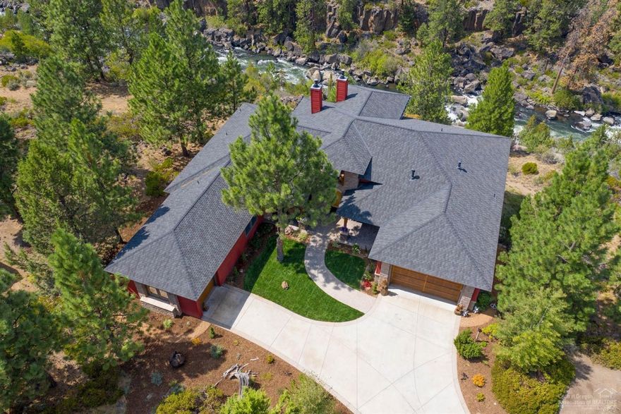 Rare opportunity to own your private view of the Deschutes River in Bend, Oregon. Enjoy unobstructed views and listen to the river rushing below. The westside single level home, boards privacy, entire back of the home has new Trex deck to maximize the 180-degree view. This single level home has large gathering space with spacious open kitchen with new counter tops, extensive cabinetry, stunning master suite with sitting area looking over the river, four full bedrooms, 2 car garage & single car garage w/picture window. Could easily be an office/gym/studio, new furnace and a/c appliances, epoxy garage floors landscaping, carpet and panting. Enjoy the trail head just steps away, along with a short walk to the community pool, tennis/pickle ball/fitness room & club house. Enjoy nature, River Canyon amenities and all Bend has to offer.