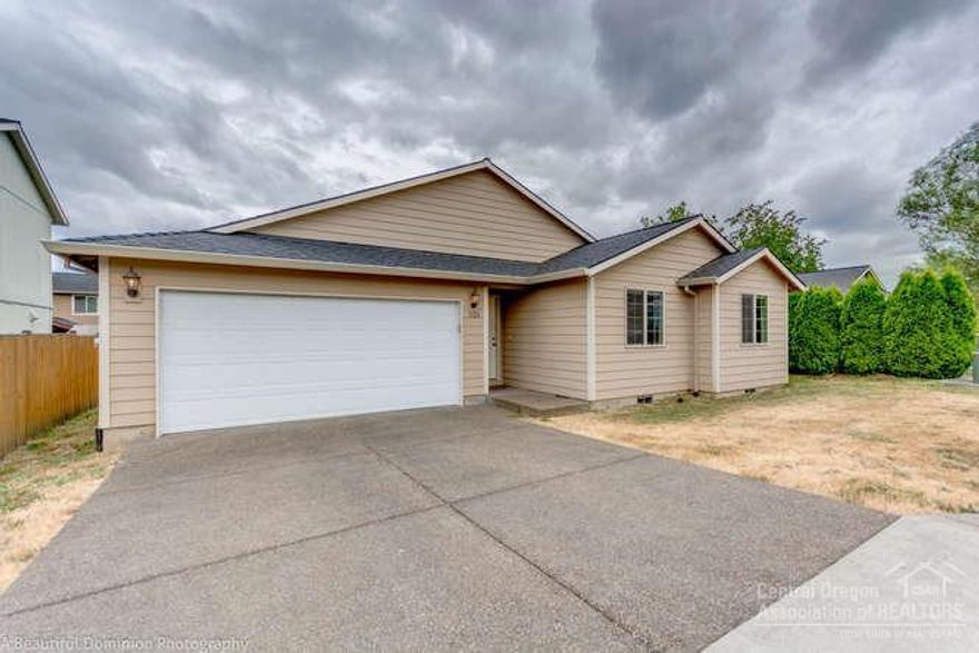 Turn key home seeks new owners! Neat & clean, move in ready home w/efficient floor plan. Spacious vaulted great room w/accent lighting, dining area & open kitchen w/bar seating. Plenty of storage & counter space. Master separation, walk in closet & large bath. 3 bedrooms & additional bath on opposite side of home. Mud/Laundry room w/sink & folding counter. Fenced back yard w/low maintenance landscape. Finished garage w/opener & storage space. Next to an orchard & close to schools!