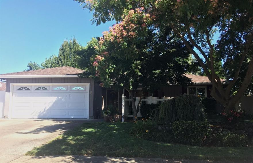 Well taken care of 3 bedroom 2 bath home. Great room design with kitchen open to great room and dining area. Hickory hardwood floors in entry, great room, dining area, kitchen and hallway. Kitchen features double oven, new microwave and great storage space. Covered front porch with courtyard great for entertaining or relaxing. Covered patio and large backyard with mature landscaping and trees. Home shows pride of ownership!