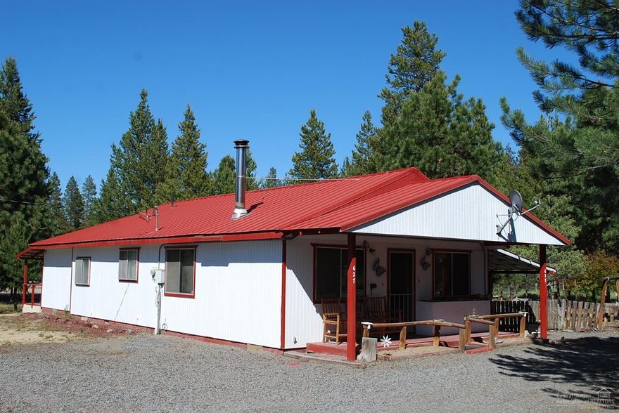 Cute little ranch style cabin just south of La Pine! Well maintained 2 bedroom, 1 bath, with an office, de-attached garages, park like setting. Seller is offering a 1 year home warranty to the buyers! Newer appliances in the kitchen.