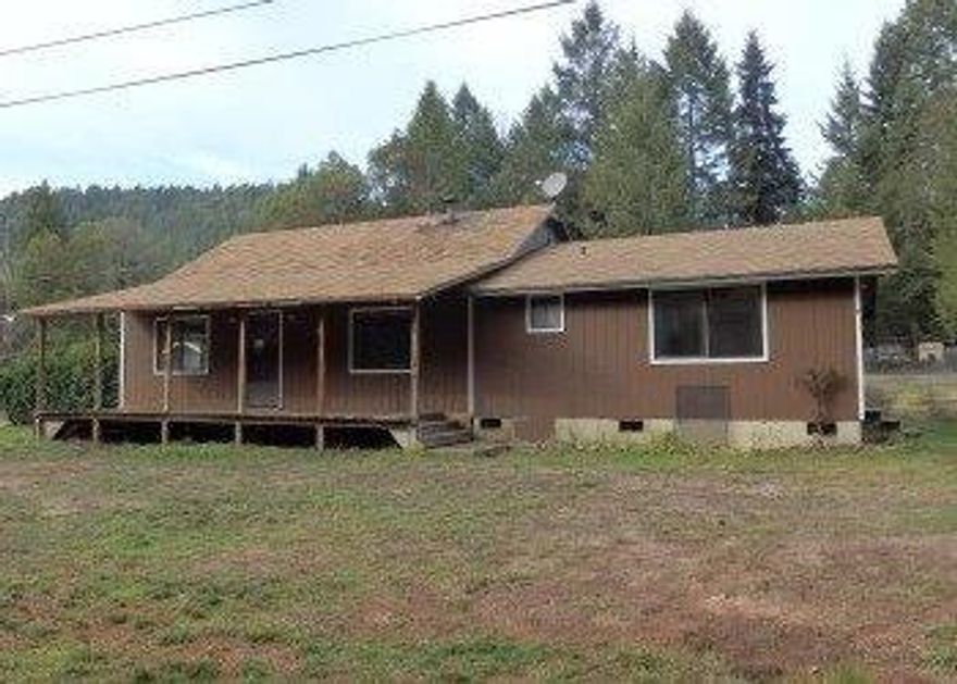 Cozy Cottage just outside of Glendale. Easy access to I-5. Level lot with some trees. Storage sheds. Garden area. Home will need some work, but appears solid, so bring your imagination. Front and rear decks/porches for outside enjoyment.