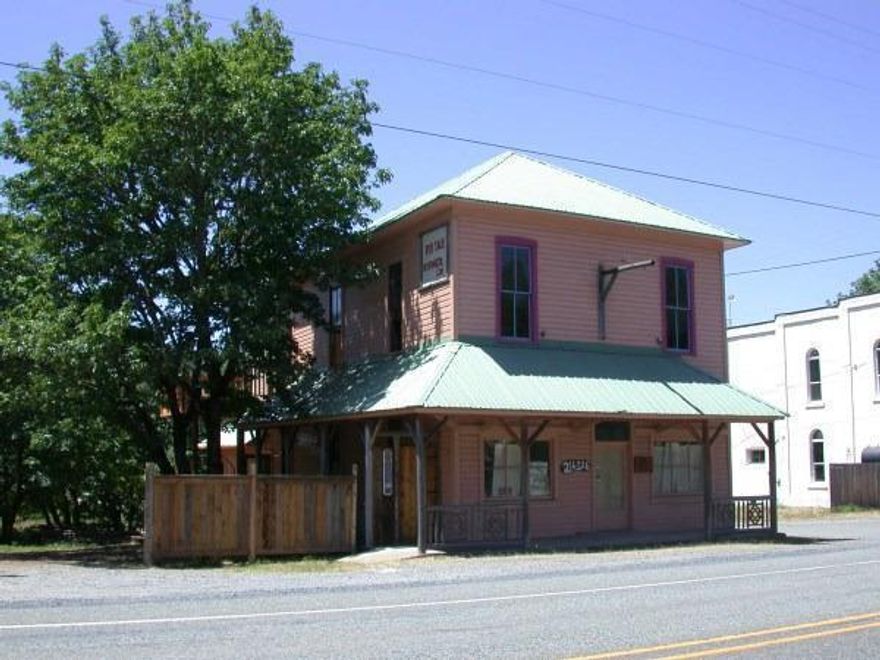 Huge Price Reduction! Historic (but not registered as such) commercial property with frontage on Hwy 199 (Redwood Hwy). Redwood Hwy runs between Grants Pass and Crescent City with many tourists traveling through. Over the years this building has been home to several businesses including the Kerby Post Office and Kauffman Wood Products. It is presumed to be the oldest building in the Illinois Valley. It sits across the street from the Old Stoney Front Tavern (now the G-Spot Bar and Grill) and the Kerbyville Museum. There is a ton of character, charm, and potential here not to mention space (2860 sq ft inside plus an unfinished basement with approximately 1716 sq ft). Possible Restaurant? Antique store? Large open spaces upstairs and down for retail display. Studio apartment in back, also the upstairs has a full bath and is plumbed and wired for a kitchen. Has a well in addition to city water. Owner may carry on an adjacent 0.17 acres. More historical data available upon request