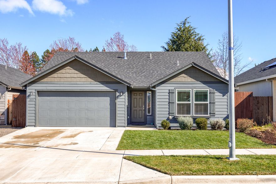 Welcome to this charming 3-bedroom, 2-bathroom home centrally located in Medford! Situated close to schools, shopping, and medical facilities, this property offers convenience and accessibility. The 1408 square foot mid-sized home is designed for comfort and efficiency. Enjoy a spacious fully fenced backyard with an extended patio, perfect for outdoor entertaining. Inside, the well-designed kitchen features a breakfast bar and ample counter space, overlooking the spacious living and dining room with a vaulted ceiling. The separate vaulted ceiling primary suite offers privacy and includes two large closets and a large dual vanity bathroom. Two additional sizable bedrooms share a full bathroom, completing this smartly designed home. Don't miss out on this opportunity - schedule your viewing today!