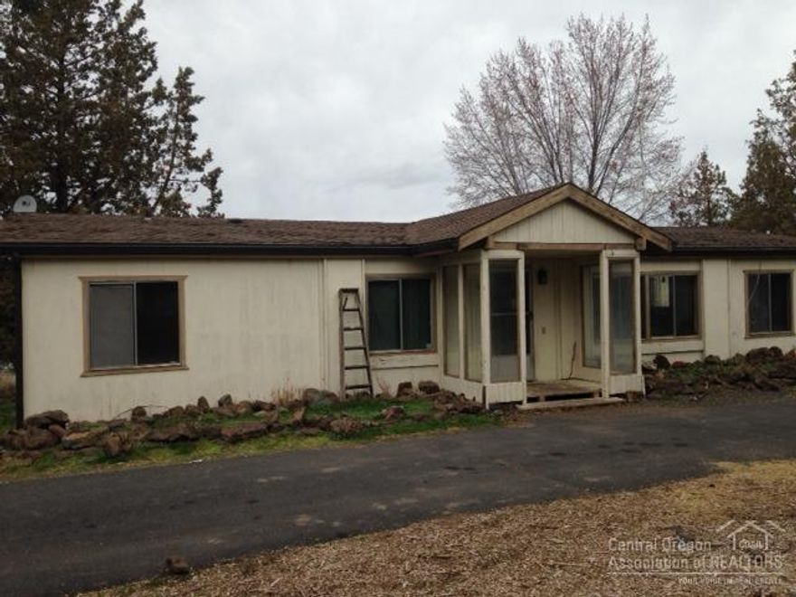 Large living room and kitchen with vaulted ceilings. Paved driveway and privacy off a dead end road. All fenced with average to good views of the Cascade Mountains. Two 8 x 12 storage buildings. Detached garage has 3 spaces and the grounds have deciduous and fruit trees.