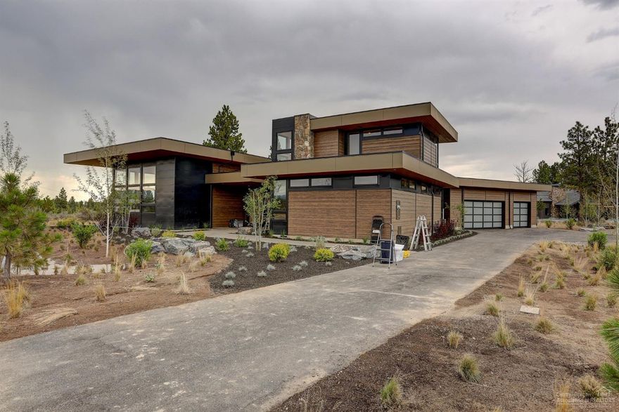 Built by BendTrend and designed by DesignHaus this home offers an opportunity for the discerning buyer looking for main level living, mountain views, exceptional outdoor spaces and a design that leaves nothing behind. There are 3 bedroom suites on the main level plus the powder, office and designer mudroom. The 4th bedroom, bath and bonus are upstairs providing a separate haven for guests and hang time. This home sits on over a half acre across from deeded unbuildable common space providing added spaciousness and a protected view corridor. The contemporary interior palette is warm and elegant highlighted by two-tone kitchen cabinetry and soft reclaimed wood accents. The private courtyard off the kitchen serves as home to morning coffee dates with happy hour being held on the covered side terrace while you BBQ on the built-in outdoor grill. A true show stopper of quality in the sought-after Tetherow community that should not be missed. Completion scheduled for early July.