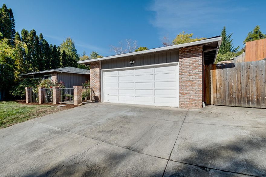 This beautiful East Medford home has 3 bedrooms 2 full baths plus an office which could be a 4th bedroom option? The large open kitchen has wood cabinets, stainless appliances, and wine rack with plenty of counter space and storage. This home has had many recent updates including LVP flooring throughout, a complete master bath remodel to include a soaking tub, tile standup shower, and tile flooring as well as new matching tile in the guest bath. The home includes a family room in addition to living room for plenty of comfortable living space. The large landscaped back yard is a great place for  barbecuing, entertaining and has a beautiful view of RoxyAnn.  Small trailer parking.