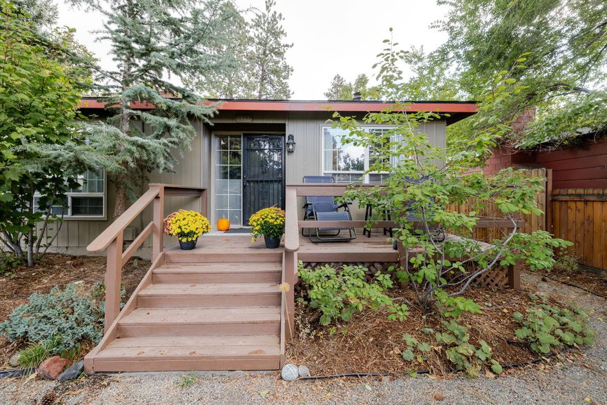 East Midtown oasis 1 mile from downtown Bend. This 4-bedroom, 2-bath Midcentury home on a large city lot features an extensive organic edible landscape. Located directly across from Orchard Park & just blocks from Midtown Yacht Club and shopping. Nearly 1,800 sq. ft. of single-level living includes two welcoming living rooms: one w/ gas fireplace, the other w/ wood insert framed by floor-to-ceiling brick. The kitchen/dining areas highlight Spanish tile floors & decorative tile counters. The primary suite has glass sliding doors that open to the back deck, hot tub & garden. Outdoor living is extraordinary w/ two decks, raised beds & a bounty of fruit trees/ berries/ herbs/flowers with drip systems in place. Three immense Ponderosa pines grace the property which offers privacy and tranquility. Fully fenced/off-street parking, a two-car garage & large shed that could convert to studio. Recent upgrades include Central A/C, air purification, heating system, solid wood doors, fresh paint.