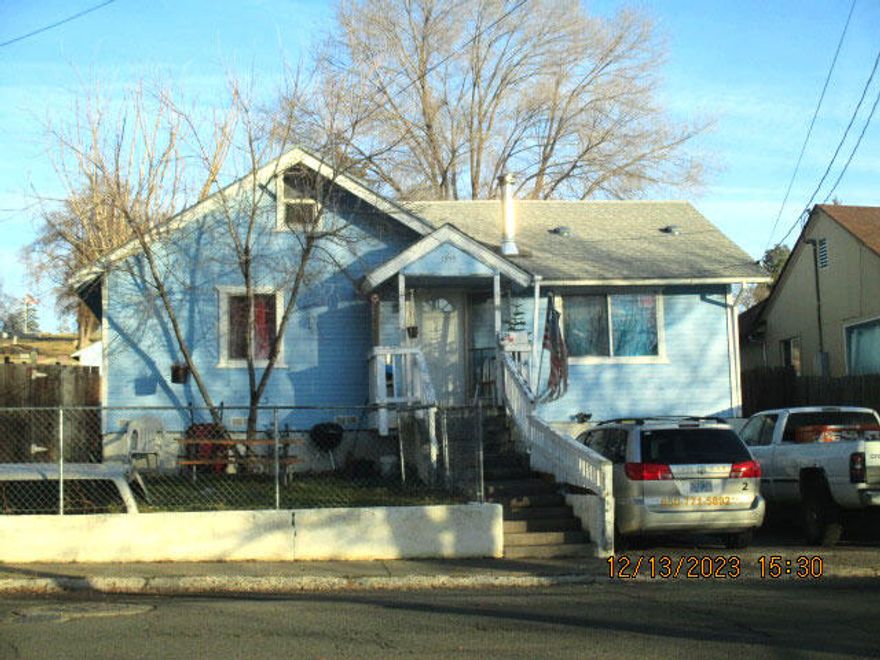 Good Investor Opportunity!  Long-term tenant.  2BR/1BA home located near schools, shopping and public transportation. Property needs foundation repairs and the back porch needs to be rebuild.  Sold as-is.  Small garage is in the basement. Also has a small, finished loft.