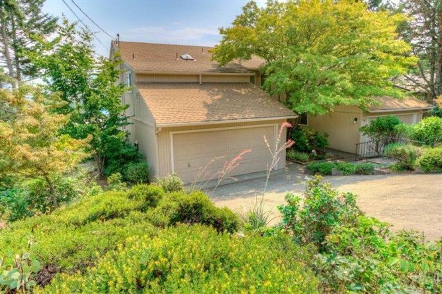 Very clean and well maintained contemporary Townhome (not in a Home Owner's Association and no fees.), with wonderful views of the mountains, as well as valley and city views to the East. On a dead-end quiet street. On the deck off the dining room there is lots of morning sun to enjoy sitting on either of the two decks and have breakfast or have an evening dinner in the shade. Two bedrooms, one being the master bedroom with master bath. Off the master bedroom is another nice East facing deck with fabulous views. There is also a bonus room behind the master bedroom that would make a nice office, den or infant's bedroom. Attached 2 car garage with lots of shelving and storage. Nice backyard with lawn and a fenced organic garden. Less than a mile from downtown Ashland and just a 20 minute walk to Oregon Shakespeare Festival theaters, restaurants, stores and beautiful Lithia Park. Don't miss this one in our fast moving real estate market.