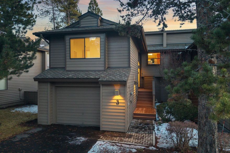 Enjoy the best of Sunriver in this pristine Fairway Village Condo! Thoughtfully updated, this home features new LVP flooring in the living room & all three bedrooms, a stunning floor-to-ceiling fireplace surround, & beautifully renovated bathrooms with modern lighting and plumbing fixtures. The great room boasts vaulted wood ceilings, a cozy gas fireplace, a balcony, & a lower patio. The kitchen offers updated counters, a tile backsplash, tile floors, an eating bar, & stainless appliances. The primary suite is upstairs, separate from two additional bedrooms & a bath on the lower level. Comes fully furnished with quality pieces in excellent condition. Park a car or store your gear in the single-car garage with ample storage. Located in Sunriver's desirable North end, with easy access to Woodlands Golf Course, the North Pool, and a private complex pool. A perfect retreat for a second home getaway or an income-generating vacation rental!