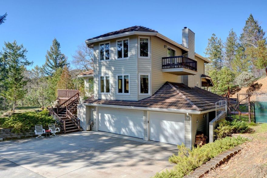 Beautiful, unique, custom-built home on two tax lots totaling 19.99 acres! The house is situated in a gorgeous, private setting close to town with views of the mountains from the wrap-around deck. With 2,848 sq ft of space the possibilities are endless! Jackson county has it labeled as a 4 bedroom, but it is designed as a 2 bedroom with bonus rooms. It offers 2 full & 2 half baths. Lots of room for entertaining & storage with multiple sheds. There is also a large garage, covered RV parking, an additional detached garage/workshop & a paved driveway. Inside, the home offers plenty of natural light; beautifully detailed woodwork, tile & carpet throughout. The kitchen is bright and spacious with plenty of storage. Generous main bedroom features a walk-in closet & deck that overlooks the property. The attached bathroom has a walk-in shower, jetted tub, beautiful tile work & dual sinks. The laundry room is separate & spacious with lots of storage. This is a house you will want to see!