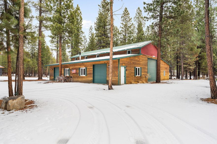 Beautiful custom shop home sitting on 1.96 acres! 2,200 sqft shop with an attached 896 sqft welcoming house. Finished shop offers 12' and 14' pull through doors + two standard, 400 amp wired for a welder, and a 50 amp RV hook up. All the space you need for work, toys, & trailers. The attached home has a thoughtful design maximizing space with a nice knotty pine kitchen including new stainless appliances, pantry, great room with a wood stove, solid maple doors and radiant floor heating throughout. Primary suite, spacious full bathroom with a custom tile shower, double vanity and soaking tub with jets. Laundry room with half bath also. Enjoy privacy on the big trex deck and evenings around the fire pit. Property has 3 full RV hook ups with 30 amps and 2 additional 200 sqft sheds. Amazing location for vacation home, primary residence, or a wonderful opportunity for short term rental. Minutes to town amenities, 20min to Cascade Lakes for both prime Summer and Winter adventures!