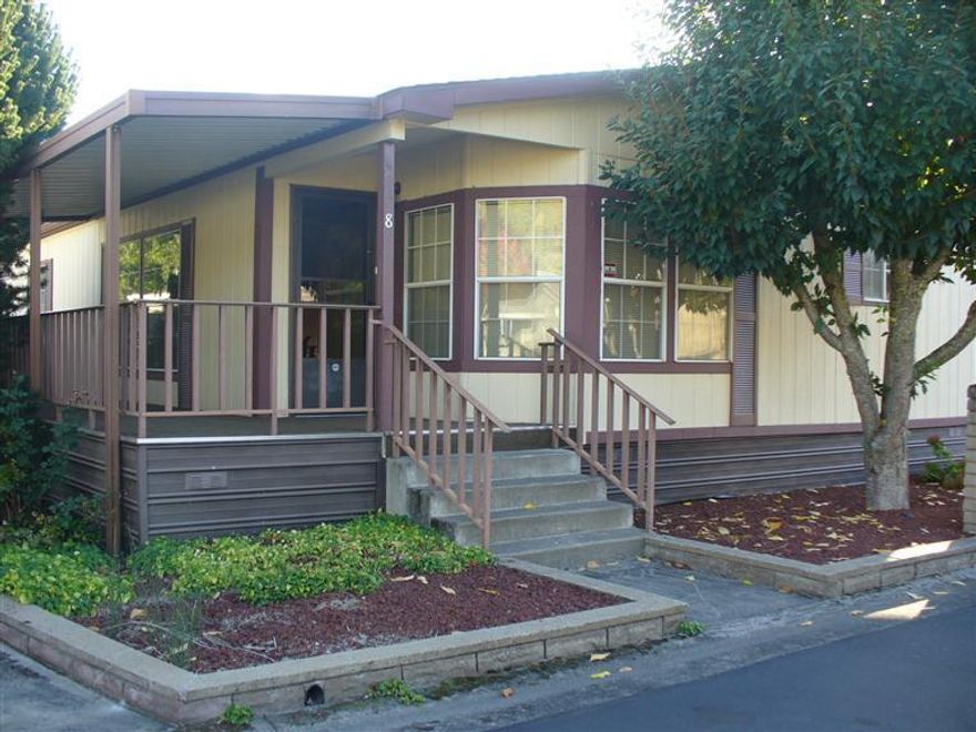 Home in 55+ Park with friendly neighbors and Rogue River frontage. Ready to move in, just bring your fishing pole and belongings. Nice open floor plan with French doors to the office.