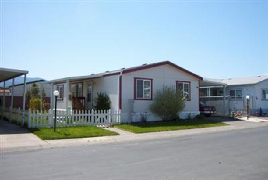 FAMILY PARK. WAITING FOR A FAMILY TO CALL THIS HOME. NICE SIZE KITCHEN AND LIVING ROOM. VAULTED CEILINGS. SPLIT FLOOR PLAN. THREE BEDROOMS, TWO BATHS. FENCED YARD WITH PRIVATE, COVERED DECK. LARGE STORAGE SHED. CLOSE TO SCHOOLS, CITY PARK AND GOLF COURSE.