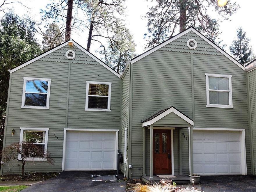 Wonderful Park Rose Town Home on Coleman Creek in Phoenix. This 3-bedroom, 2 bath 1,410 square foot home has been freshly painted inside, has new carpet throughout, and offers two large decks overlooking the creek and community open space, natural landscaping, pleasant walkways and soaring pine trees. The upper level features open concept living with a vaulted great room, kitchen with island cooking and lots of cabinetry, dining area,and lovely views from the deck. The master suite includes a spacious walk-in closet and well-appointed bath. The ground level offers 2 bedrooms, nice guest bath, laundry, entry hall and a second deck. The single-car attached garage is fully finished, plus there is additional driveway parking. $165 per month HOA dues include landscaping maintenance plus reserves for roof and exterior paint. Must See!