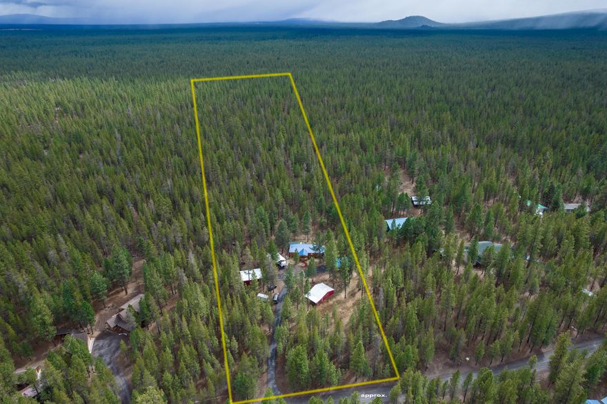 Privacy among the Ponderosa's on 10+ acres in desirable Ponderosa Pines Subdivision. Recreation right out your back door with endless miles of dirt roads to ride horses, ATVs or cross-country skiing. Experience the wildlife & the extraordinarily unique trails, & only a short distance to Wickiup. This immaculate Country Sheik home has a vaulted open floor plan entry, with a great room & wood burning stove. Guest bedrooms on either side of guest bathroom with primary on suite separation. Updated Kitchen countertops, new flooring looks like wood plank laminate. Enclosed back patio with firewood storage, enjoy your backyard wildlife sitting by the fire pit.  Paved driveway, detached 24x24 garage, 24x30 shop with concrete floor, person door & 10 ft roll up door. 32x32 Horse/Hay, 4 stall w/storage container, 10x10 Greenhouse, 20x30 RV cover & includes a chicken house. The HOA covers road maintenance, snow removal, & metered water.