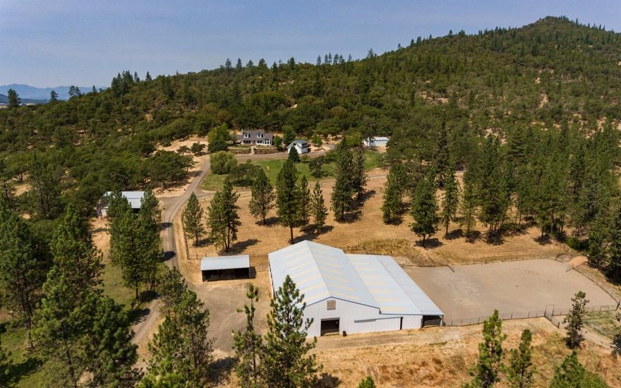 Eagle Point Trails Ranch is an 80 acre Equestrian Jewel. The property features Water Rights from EPID, EFU zoning, 2 homes, & privacy. The horse infrastructure includes a 5 stall barn, both indoor & outdoor arenas, tack room & wash bay with hot water. 5 pastures with well-maintained fencing make the ranch ideal for horses or a small cattle operation. Large hay storage buildings, equipment sheds & shops complete the ranch's infrastructure. The 2,324 sq. ft. main house includes three bedrooms & two & a half bathrooms with the master suite on the main level. The newly built guest house is beautifully constructed & features one bedroom & very stylish living area. The ranch has access to city water for domestic & stock use. Located in an area of similar sized properties, this ranch is very private & quiet. There is an extensive water canal system over the property with water falls & large canals.