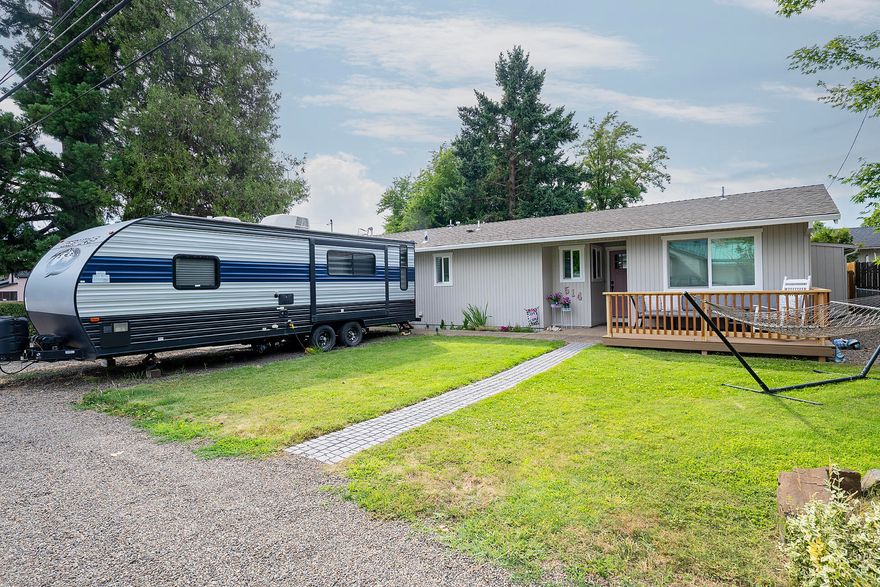 Step into comfort and style with this thoughtfully upgraded ranch-style home where every detail has been carefully considered. The spacious, open concept living and dining areas flow seamlessly into a fully remodeled kitchen featuring quartz countertops, custom cabinetry, tile backsplash and stainless steel appliances. Three bedrooms plus an additional room converted into a bedroom with a walk in closet (connected to a Jack and Jill bathroom), 2 baths, 2 living areas allow plenty of space for friends and family.  Engineered wood flooring, recessed lighting and complete the look! Outside enjoy your own private retreat with a fully fenced backyard, covered patio, raised garden beds and a large shed.