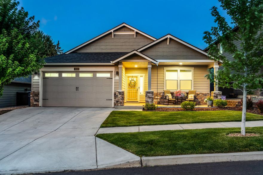 Tucked into a quiet northeast Bend neighborhood just minutes from Pilot Butte, St. Charles Hospital, and local favorites like On Tap, this charming single-level home blends convenience with thoughtful design. Inside, an open floor plan welcomes you with vaulted ceilings, hardwood floors, and a spacious great room anchored by a cozy gas fireplace. The kitchen features quartz counters, stainless steel appliances, and ample prep space—ideal for both weekday meals and weekend gatherings. Step outside to a fully fenced backyard that feels like your own private retreat, complete with mature landscaping and a covered patio for year-round enjoyment. With three bedrooms, two full baths, and thoughtful finishes throughout, this home is an easy fit for those seeking comfort, style, and a location that puts Bend's best amenities within easy reach.