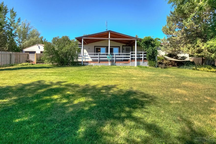 Mini Farm awaits new critters & Owner! Spacious home w/open plan, 2 living spaces & Master separation. Tons of storage in the kitchen w/ample counter space w/adjoining Dining room. Property is fenced & crossfenced w/chicken coop, sheep & goat enclosures & shelter, horse corral & barn, hay, tack & tractor storage. Irrigation ditch runs through & feeds the pond w/3 acres of irrigated orchard grass. Oversized dbl garage w/shop area, private well, playhouse, patio w/firepit, covered decks, fenced yard & MORE!
