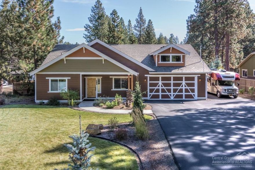 Quiet setting surrounds this stunning single level home in DRW. Open concept living area with vaulted ceilings, accented by a lot of natural light, and a spacious kitchen that includes cooktop, tile countertops, large island, and walk-in pantry. Hardwood floors throughout, with masonry accents on the gas fireplace in living room. Luxurious master suite with soaking tub and tiled shower. Third bedroom is currently a den/office. <br>Beautifully landscaped backyard with 18x24' additional concrete patio, outdoor TV, and bar for great outdoor space. <br>This home sits on a spacious, fully fenced lot with mature pine trees, privacy, and plenty of room to park RV, boat, and toys! All this with easy access in/out of DRW to Hwy 97<br>