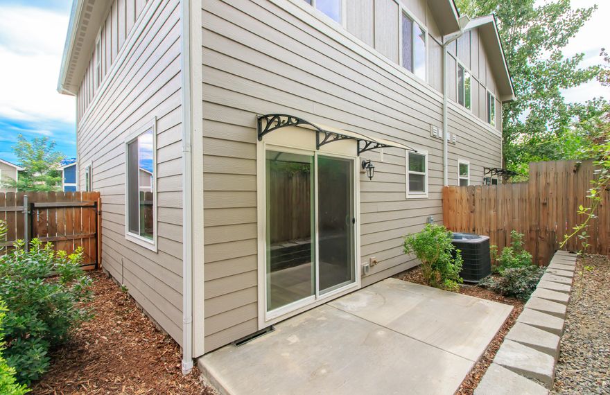 This beautiful low maintenance end unit townhome was built in 2018  in a quiet, convenient complex. The downstairs has an open floor plan with Living Room, Eating Area, Kitchen with granite countertops, stainless steel appliances & pantry plus a half bath Upstairs are 3 bedrooms, including a primary with vaulted ceiling, walk in closet & full bathroom with shower. The guest bathroom is a shower/tub combo with linen storage. The Laundry closet is conveniently located in the hall between bedrooms. Enjoy lower utility costs in this green, energy efficient townhome built to Earth Advantage standards. The downstairs and bathrooms have wood simulated laminate floors with carpet on the stairs & bedrooms_ The home has forced air heating and cooling system, fenced patio/side yard, & paved parking with 2 spaces per unit. It is located just blocks from the new Phoodery.
