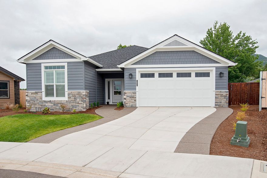 Another incredible home by Brian Magel Construction in Cedar Landing, East Medford's Premier Planned Community. A beautiful and quiet neighborhood with proposed 2.91 miles of trails and over 20 acres of open space. This amazing single level home with 3 bedrooms and 2 full baths, energy efficient home with so many upgrades, impressive kitchen w/granite counter tops, upgraded stainless steel appliances, step coffered ceiling in family room, an abundance of engineered hardwood flooring, tile in laundry room/baths. Energy efficient HVAC system, upgraded cabinetry, upgraded closetry packs, upgraded insulation and much more. Oversized Master suite has 2 sinks, walk in tile shower w/custom built cabinetry. Open floor plan with an oversized great room, large kitchen with center granite covered island and dining area. Oversized 2 car finished garage and split bedroom floor plan. This is one of the best homes in the area, come see!!!