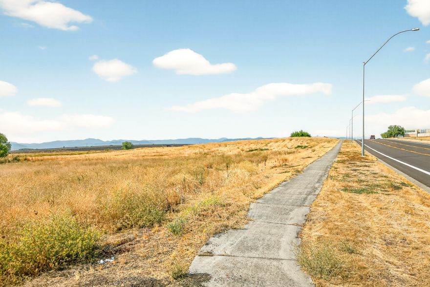 This prime Light Industrial parcel offers endless possibilities, just 2.5 miles from the Medford Airport and Interstate 5, and minutes from shopping, dining, and major retailers, including Costco, Walmart and Amazon warehouse. Zoning allows for a wide range of uses—such as business offices, manufacturing, warehousing, and even farming (see attached document for full list). Utilities are available to the lot; capped well on-site. An adjacent 1.68-acre parcel, Tax Lot 901 (MLS #220208327), is also available, offering an excellent opportunity for expansion or development flexibility.