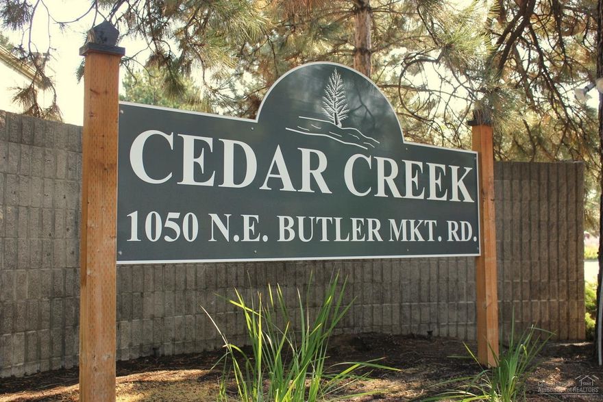 This Condo features an open floor plan that includes a wood burning fireplace in great room, breakfast bar in the kitchen, two large master suites with soaking baths and showers as well as separate private balconies. There is a detached double car garage, with a covered walk way to the home, about 5 feet. Great location with easy access onto the Parkway and more. Enjoy the community clubhouse with pool and hot tub. The HOA includes water, sewer, exterior maintenance, pool and community amenities.