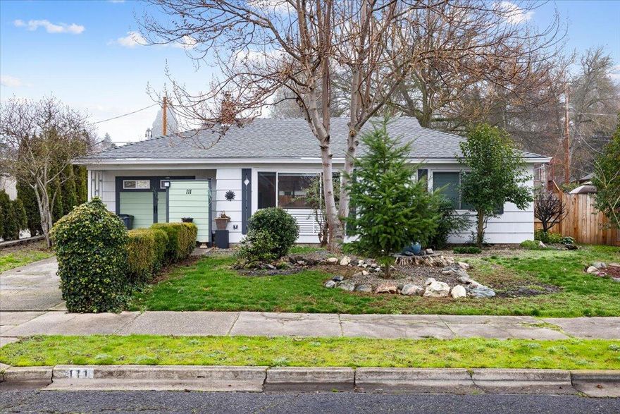 Welcome to this charming 1951 cottage that perfectly blends vintage character with modern updates in sought-after Old East Medford. Nestled on a peaceful tree-lined street, this 2-bedroom, 1-bath home showcases gleaming refinished hardwood and tile floors throughout. The thoughtfully remodeled kitchen and bathroom bring contemporary convenience while maintaining the home's classic appeal. Stay comfortable year-round with a new HVAC system, while the versatile converted garage space opens endless possibilities for a home office, studio, or hobby room. The owner has recently updated the plumbing and electrical systems as well. Outdoor living shines with a covered patio and fully fenced backyard - perfect for relaxing or entertaining. The detached garage, accessible via its own private alley and set far back from the main home, presents an exciting opportunity for conversion to an ADU. Don't miss the chance to make this super adorable cottage your home sweet home. Property sold as is.
